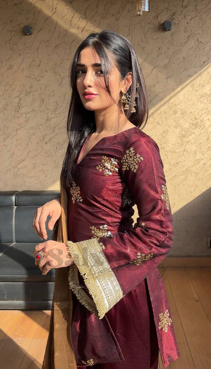 A Portrait of Grace in a Luxurious Maroon Ensemble