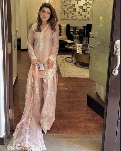 A Vision of Confidence in a Stylish Pink Suit